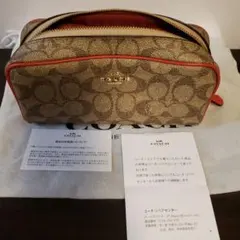 COACH キャンバスポーチ 。ベージュ/オレンジ。お値引き不可