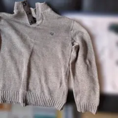 ベージュ ボタン付きハイネック ニットセーター