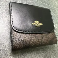 コーチ 二つ折り財布 シグネチャー 黒 レザー コンパクトウォレット 美品のサムネイル