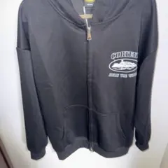 CORTEIZ ブラック フルジップパーカー Corteiz Arch Shield Zip Hoodie Black Men's - FW25 - US