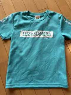中古　Luz e Sombra アクアブルー シャツ 130
