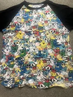 STUSSY キャラクター総柄 ラグランTシャツ