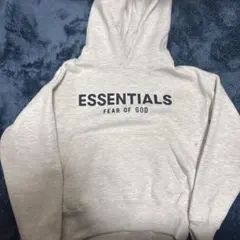 ESSENTIALS フード付きスウェットパーカー ライトオートミール FOG ESSENTIALS - 21SS BACK LOGO HOODIE (RUBBER) / ダーク