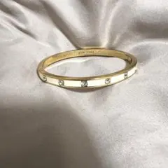 Kate Spade ゴールド ホワイト バングル　ブレスレット　ストーン付き