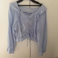 continuer de NICE CLAUP フリルブラウス ライトブルー