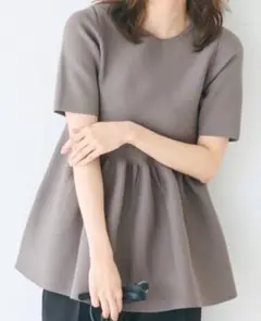 スポンディッシュニットペプラムトップス