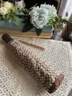 COACH ミニシグネチャー柄 ワンタッチ式 折りたたみ傘