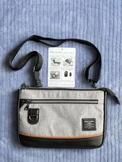 【未使用・極美品】多機能ショルダーバック　グレーUSBポート付きPリング装備