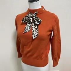 オレンジ 長袖ニット ヒョウ柄リボン付き