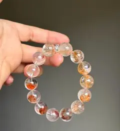 水晶とオレンジビーズのブレスレット