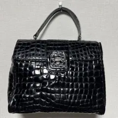 コッコフィオーレ　ブラックエナメル調ハンドバッグ