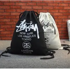 STUSSY ロゴ入り ドローストリングバッグ 黒白　セット STUSSY ロゴ入り ドローストリングバッグ 黒白 セット - メルカリ