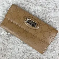 GUCCI シマ ロゴプレート Wホック 長財布 イエロー - メルカリ