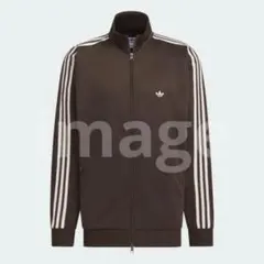 9925 adidas トラックトップ ジェンダーニュートラル ダークブラウン