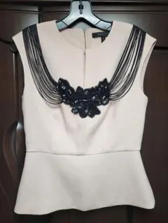 フリンジ装飾ピンクノースリーブトップス