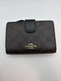 COACH 二つ折り財布 シグネチャー柄