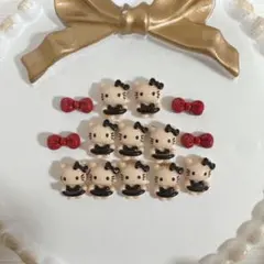 キティちゃん 日焼け黒ネイルパーツ デコパーツ 10個セット(パーツおまけ)
