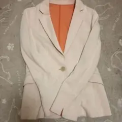 クリーム色 テーラードジャケット オレンジ裏地