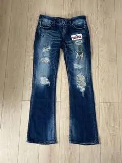 ヴァンキッシュ ダメージ加工 スタッズ フラップポケット フレアパンツ 