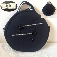 センソユニコ 牛革　円形黒ナイロンハンドバッグ　個性的　カバン