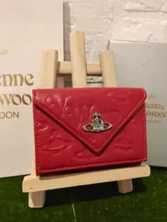 Vivienne Westwood 新品 赤 レター型 型押し ミニ財布 銀 - メルカリ