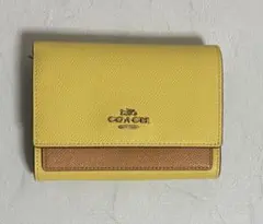 COACH イエロー×ブラウンの二つ折り財布のサムネイル
