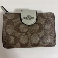 coach コーチ　二つ折り　ミニ財布　ベージュ　レザー　シグネチャー　ロゴ柄