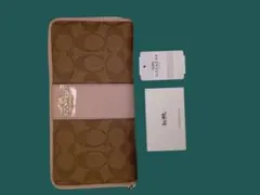 [新品未使用品] COACHアウトレットブラウンのシグネチャー柄とピンクの長財布