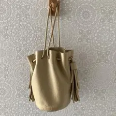 NOMADIS ベージュ フリンジ付き巾着バッグ