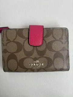 新品未使用]COACHコーチ二つ折り財布 シグネチャー 花柄 リボン ピンク