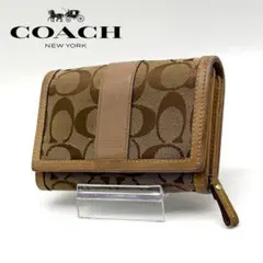 【美品】COACH レザー 二つ折り財布 シグネチャー 総柄 ロゴ ブラウン