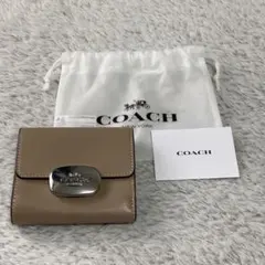 【美品】COACH コーチ 二つ折り財布 ベージュ 保存袋付き レディース 財布