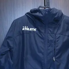 ATHLETA ネイビー ピステ・ウィンドブレーカー