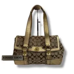 coach hand bag turn lock signature gold