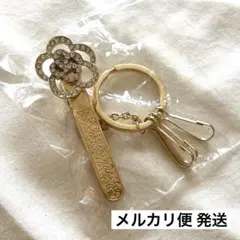カメリアモチーフ バッグ チャーム ゴールド お花 クリップ キラキラ 匿名配送