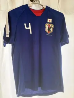 サッカー日本代表　応援ユニフォーム　闘莉王 TULIO４　表記サイズＭのサムネイル
