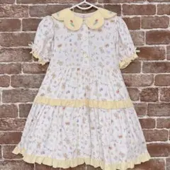 ナイルパーチ クマ柄リボンつきイエローワンピース - メルカリ