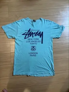 Stussy World Tour Tシャツ ライトブルー Lのサムネイル