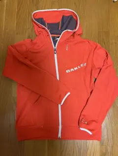 OAKLEY ゴルフウェア ジャケット メンズ オレンジ