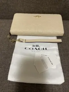 新品タグ付き】COACH パンチングホワイトシグネチャー 長財布 リスト