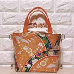 帯リメイク　オレンジ色地　祝い古典柄刺繍　あおりポケ　オフホワイト色巾着トート