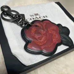 コーチcoachチェリー型グリッターキーホルダー - メルカリ
