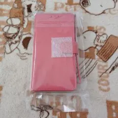 ピンク スマートフォン用ウォレットケース、ストラップ付き。