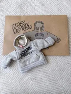NEWS STORY HOODIE KEY RING