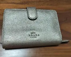 COACH ゴールド二つ折り財布