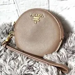 良品✨PRADA ラウンドコインケース　サフィアーノ　ストラップ付き　メタルロゴ
