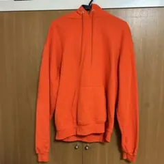Champion オレンジ フード付きパーカー