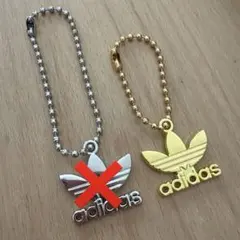 adidas ノースフェイス キーホルダー ゴールド1つ