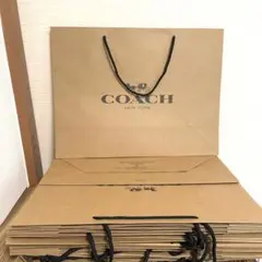 COACH コーチロゴ紙袋　大サイズ　100枚 枚数対応可　未使用　ショッパー COACH コーチロゴ紙袋 大サイズ 100枚 枚数対応可 未使用 ショッパー
