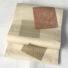 【名古屋帯】　開き仕立て　生成色　ベージュ系　錦地　 草木染めの刺繍　お上品　K